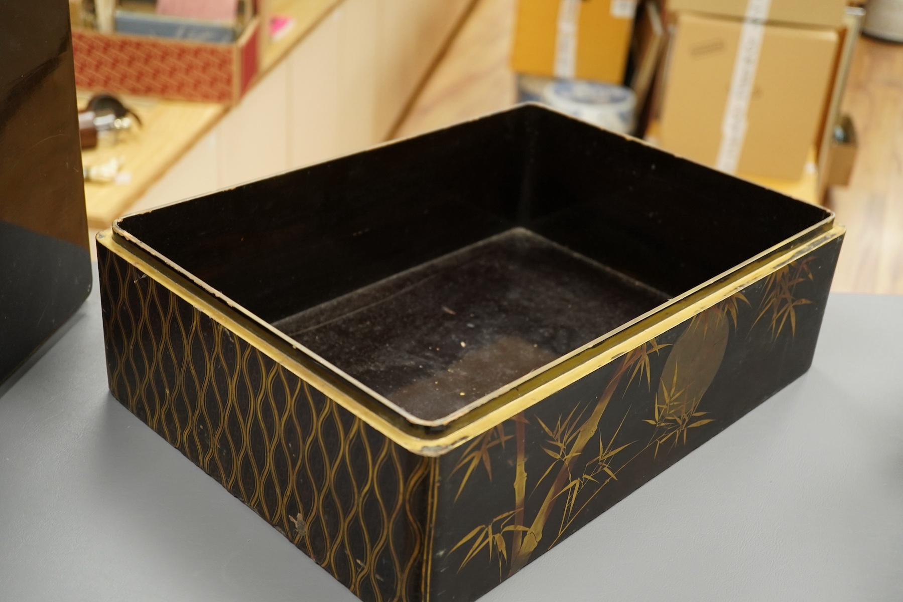 A 19th century Chinese export lacquer box containing assorted mother-of-pearl gaming counters and a 19th century Japanese lacquer box, largest 42.5cm wide. Condition - fair